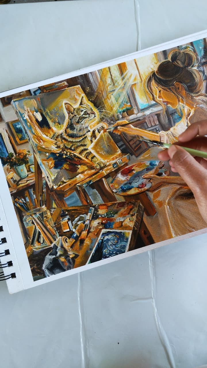 Diva painting in the studio while Kimchi watches